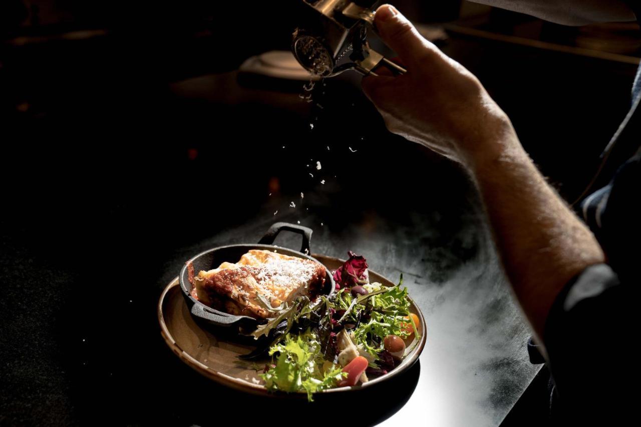 Peppers Waymouth Hotel Adelaide Exteriör bild A chef seasoning a dish