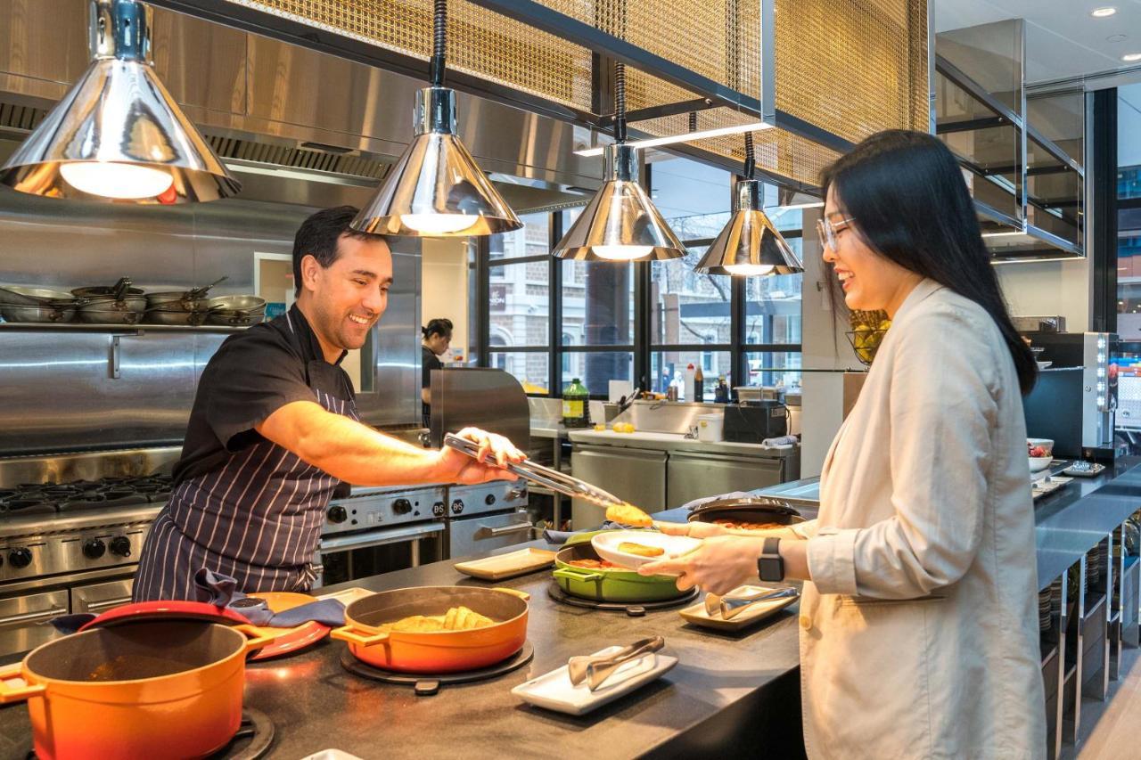 Peppers Waymouth Hotel Adelaide Exteriör bild A chef serving food at a restaurant